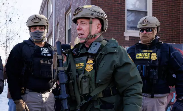 Border Patrol Cmdr. Gregory Bovino walks alongside his agents after they detain an individual near West 27th Street and South Ridgeway Avenue in the Little Village neighborhood of Chicago, Tuesday, Dec. 16, 2025. (Anthony Vazquez/Chicago Sun-Times via AP)