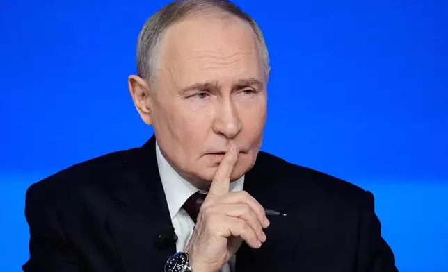 Russian President Vladimir Putin gestures while speaking during his annual news conference and call-in show at Gostinny Dvor, in Moscow, on Friday, Dec. 19, 2025. (AP Photo/Pavel Bednyakov)