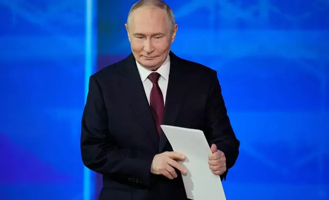 Russian President Vladimir Putin arrives to attend his annual news conference and call-in show at Gostinny Dvor, in Moscow, on Friday, Dec. 19, 2025. (AP Photo/Pavel Bednyakov)