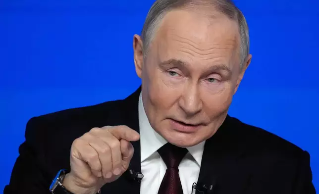 Russian President Vladimir Putin gestures while speaking during his annual news conference and call-in show at Gostinny Dvor, in Moscow, on Friday, Dec. 19, 2025. (AP Photo/Pavel Bednyakov)