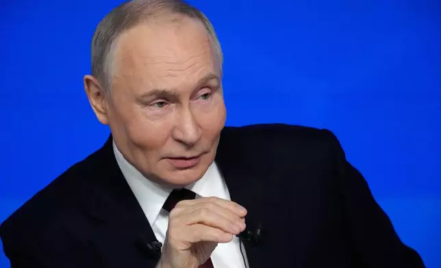 Russian President Vladimir Putin gestures while speaking during his annual news conference and call-in show at Gostinny Dvor, in Moscow, on Friday, Dec. 19, 2025. (AP Photo/Pavel Bednyakov)