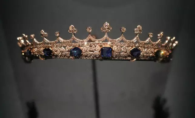 The small crown of Queen Victoria, designed by Prince Albert and crafted by Joseph Kitching, London, 1840–1842, set with sapphires and diamonds in gold and silver is displayed at the exhibition "Dynastic Jewels" organized by The Al Thani Collection at the Hôtel de la Marine museum in Paris, France, Monday, Dec. 8, 2025. (AP Photo/Michel Euler)