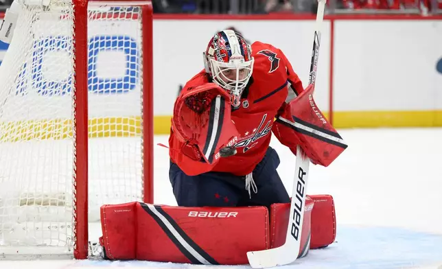 Washington Capitals goaltender Logan Thompson stops the puck during the second period of an NHL hockey game against the Toronto Maple Leafs, Thursday, Dec. 18, 2025, in Washington. (AP Photo/Nick Wass)