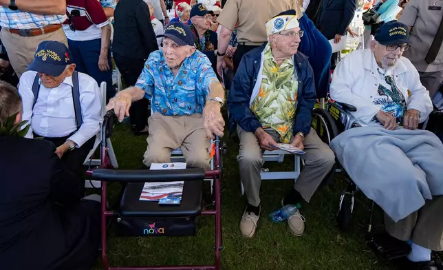 FILE - From left to right, Pearl Harbor survivors Harry Chandler, Ken Stevens, Herb Elfring and Ira "Ike" Schab sit during the 82nd Pearl Harbor Remembrance Day ceremony Dec. 7, 2023, at Pearl Harbor in Honolulu, Hawaii. (AP Photo/Mengshin Lin, File)