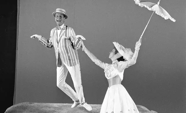 FILE - Dick Van Dyke and Julie Andrews dancing in a scene from the Disney movie " Mary Poppins" in Hollywood, Calif. June 25, 1963. (AP Photo/Don Brinn, File)