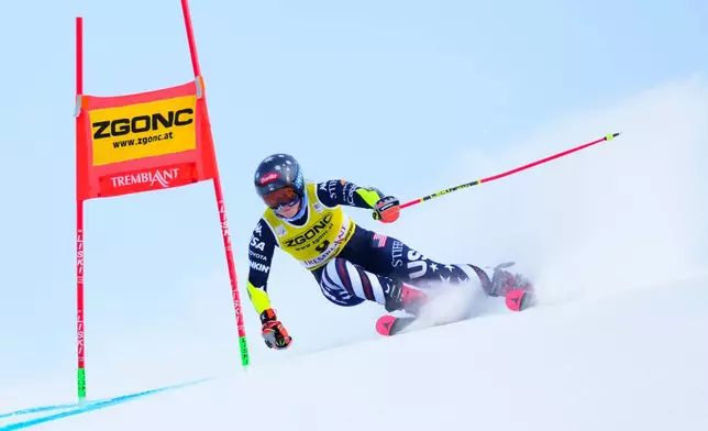 Mikaela Shiffrin, of United States, speeds down the course as she races in the women's World Cup giant slalom in Mont Tremblant, Que., Sunday, Dec. 7, 2025. (Sean Kilpatrick /The Canadian Press via AP)