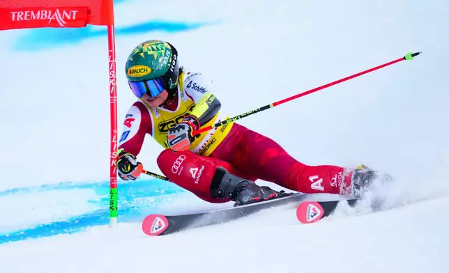 Julia Scheib, of Austria, speeds down the course as she races in the women's World Cup giant slalom in Mont Tremblant, Que., Sunday, Dec. 7, 2025. (Sean Kilpatrick /The Canadian Press via AP)