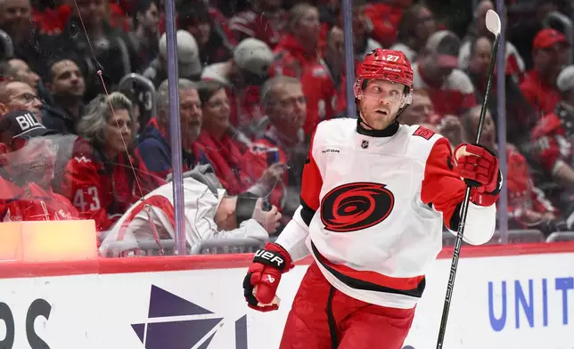 Carolina Hurricanes left wing Nikolaj Ehlers (27) celebrates his goal during the second period of an NHL hockey game against the Washington Capitals, Thursday, Dec. 11, 2025, in Washington. (AP Photo/Nick Wass)
