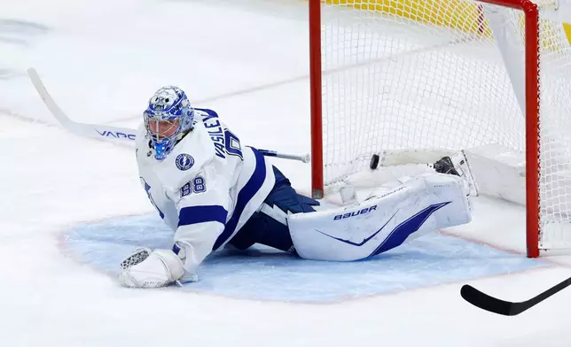 Tampa Bay Lightning goaltender Andrei Vasilevskiy allows a goal by the Florida Panthers during the second period of an NHL hockey game, Saturday, Dec. 27, 2025, in Sunrise, Fla. (AP Photo/Rhona Wise)