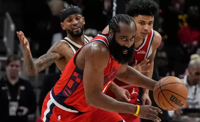Los Angeles Clippers guard James Harden (1) steals the ball against the Atlanta Hawks during the first half of an NBA basketball game, Wednesday, Dec. 3, 2025, in Atlanta. (AP Photo/Mike Stewart)