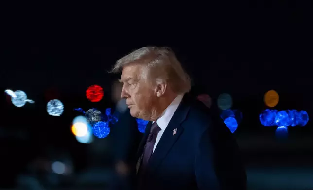 President Donald Trump arrives on Air Force One at Palm Beach International Airport, Saturday, Dec. 20, 2025, in West Palm Beach, Fla. (AP Photo/Alex Brandon)