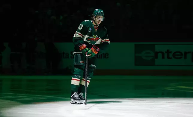 Minnesota Wild defenseman Quinn Hughes skates on the ice before an NHL hockey game against the Boston Bruins, Sunday, Dec. 14, 2025, in St. Paul, Minn. (AP Photo/Bailey Hillesheim)