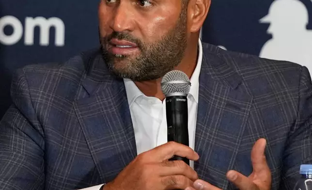 Albert Pujols, former baseball player and manager of a Dominican professional baseball team, makes remarks during a news conference at the MLB winter meetings, Monday, Dec. 8, 2025, in Orlando, Fla. (AP Photo/John Raoux)