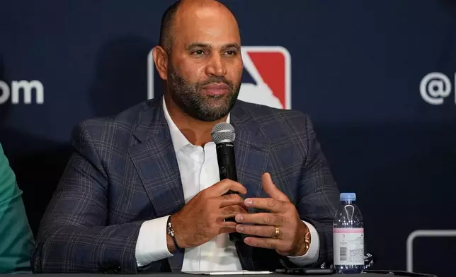 Albert Pujols, former baseball player and manager of a Dominican professional baseball team, makes remarks during a news conference at the MLB winter meetings, Monday, Dec. 8, 2025, in Orlando, Fla. (AP Photo/John Raoux)