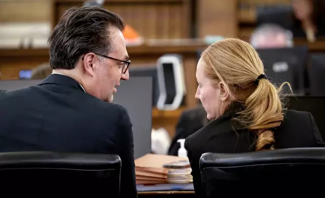Defense attorney Kelli Porges, right, confers with her client, murder defendant Brian Walshe, in Norfolk Superior Court in Dedham, Mass., Tuesday, Nov. 18, 2025. (Mark Stockwell/Boston Herald via AP, Pool)