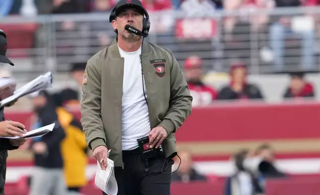 San Francisco 49ers head coach Kyle Shanahan walks along the sideline during the first half of an NFL football game against the Tennessee Titans, Sunday, Dec. 14, 2025, in Santa Clara, Calif. (AP Photo/Godofredo A. Vásquez)