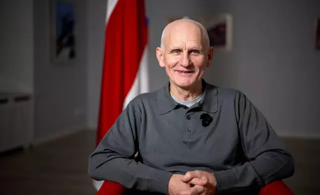 Nobel Peace Prize laureate Ales Bialiatski, one of the Belarusian prisoners released on Saturday, smiles during an interview with the Associated Press in Vilnius, Lithuania, on Sunday, Dec. 14, 2025. (AP Photo/Mindaugas Kulbis)