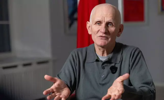 Nobel Peace Prize laureate Ales Bialiatski, one of the Belarusian prisoners released on Saturday, gestures during an interview with the Associated Press in Vilnius, Lithuania, on Sunday, Dec. 14, 2025. (AP Photo/Mindaugas Kulbis)