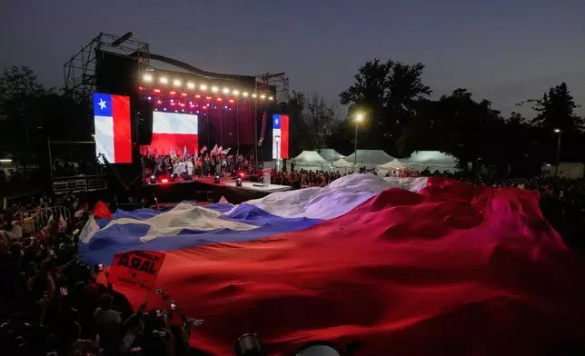 Supporters of Presidential candidate Jeannette Jara of the Unidad por Chile coalition attend a rally ahead of the presidential runoff election in Santiago, Chile, Wednesday, Dec. 10, 2025. (AP Photo/Esteban Felix)