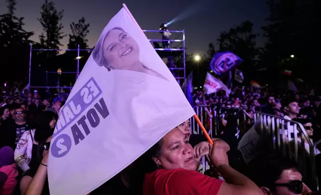 Supporters of Presidential candidate Jeannette Jara of the Unidad por Chile coalition attend a rally ahead of the presidential runoff election in Santiago, Chile, Wednesday, Dec. 10, 2025. (AP Photo/Natacha Pisarenko)