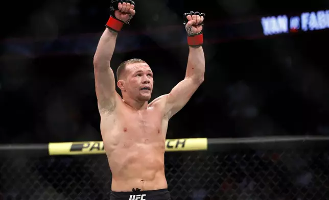 FILE - Petr Yan celebrates after defeating Urijah Faber in a mixed martial arts bantamweight bout at UFC 245, Saturday, Dec. 14, 2019, in Las Vegas. (AP Photo/John Locher, File)