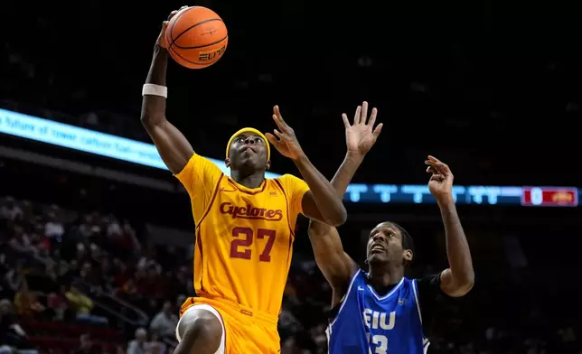 Iowa State guard Killyan Toure (27) drives to the basket past Eastern Illinois forward Nazareth Fisher (13) during the first half of an NCAA college basketball game, Sunday, Dec. 14, 2025, in Ames, Iowa. (AP Photo/Charlie Neibergall)