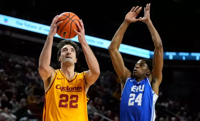 Iowa State forward Milan Momcilovic (22) drives to the basket ahead of Eastern Illinois forward Terry McMorris (24) during the first half of an NCAA college basketball game, Sunday, Dec. 14, 2025, in Ames, Iowa. (AP Photo/Charlie Neibergall)