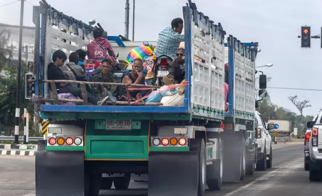 Thai residents who fled homes following the clashes between Thai and Cambodian soldiers, head to a shelter in Surin province, Thailand, Wednesday, Dec. 10, 2025. (AP Photo/Wason Wanichakorn)