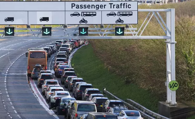 Passengers queue to enter the Eurotunnel site in Folkestone in Kent, England, Tuesday, Dec. 30, 2025. (Gareth Fuller/PA via AP)
