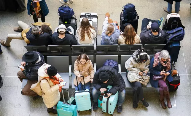 Travellers queue for Eurostar services at St Pancras International station in London, Tuesday, Dec. 30, 2025 after Eurostar asked train customers not to travel because of disruption in the Channel Tunnel. (AP Photo/Alberto Pezzali)