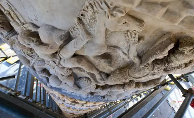 Bas-reliefs depicting scenes from a battle are seen on the second-century A.D. Column of Marcus Aurelius in central Rome during a media tour, Thursday, Dec. 18, 2025. (AP Photo/Domenico Stinellis)