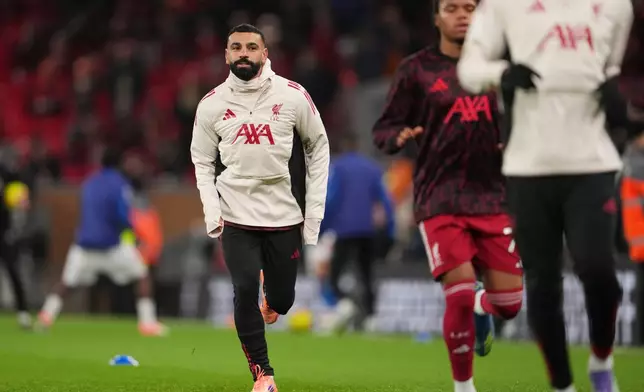 Liverpool's Mohamed Salah warms up before the English Premier League soccer match between Liverpool and Sunderland in Liverpool, Wednesday, Dec. 3, 2025. (AP Photo/Jon Super)