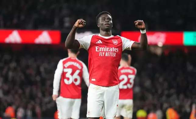 Arsenal's Bukayo Saka celebrates after scoring during a Premier League soccer match between Arsenal and Brentford in London, Wednesday, Dec. 3, 2025. (AP Photo/Kirsty Wigglesworth)