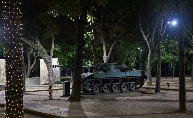FILE - An armored vehicle is on display along Los Proceres boulevard in Caracas, Venezuela, Saturday, Dec 6, 2025. (AP Photo/Ariana Cubillos, File)