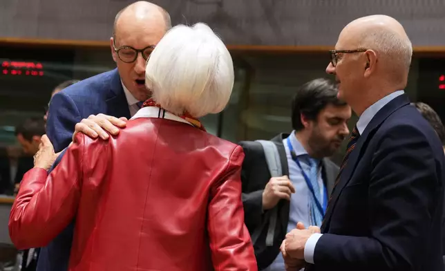 Belgium's Finance Minister Vincent Van Peteghem, left, speaks with European Central Bank President Christine Lagarde, center, and French Finance Minister Roland Lescure during a meeting of eurozone finance ministers at the EU Council building in Brussels, Thursday, Dec. 11, 2025. (AP Photo/Virginia Mayo)