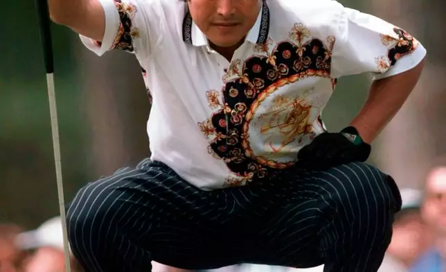 FILE - Japan's Jumbo Ozaki lines up his putt on the first green during final round the Masters at the Augusta National Golf Club in Augusta, Ga., April 13, 1997. (AP Photo/ Dave Martin, File)