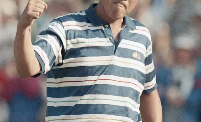 FILE - Japan's Jumbo Ozaki punches the air after making a birdie putt on the 15th green in the third round of the U.S. Open in Rochester, New York, June 17, 1989. (AP Photo/Mark Lennihan, File)