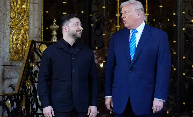 President Donald Trump greets Ukraine's President Volodymyr Zelenskyy at his Mar-a-Lago club, Sunday, Dec. 28, 2025, in Palm Beach, Fla. (AP Photo/Alex Brandon)