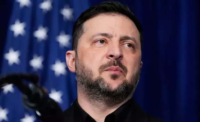 Ukraine's President Volodymyr Zelenskyy attends a joint news conference with President Donald Trump following a meeting his Mar-a-Lago club, Sunday, Dec. 28, 2025, in Palm Beach, Fla. (AP Photo/Alex Brandon)