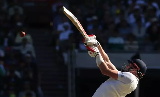 England's Gus Atkinson bats against Australia during their Ashes cricket test match in Melbourne, Friday, Dec. 26, 2025. (AP Photo/Hamish Blair)