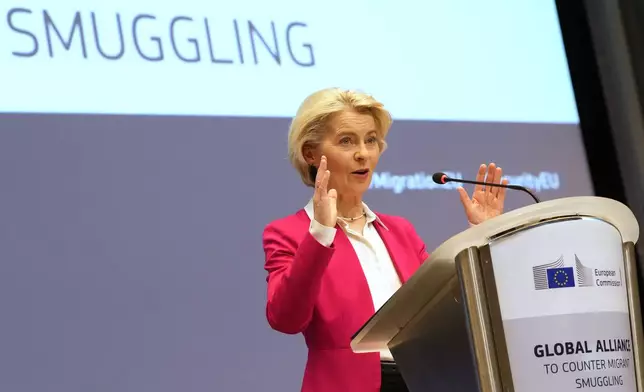 European Commission President Ursula von der Leyen addresses a Conference of the Global Alliance to Counter Migrant Smuggling at the EU Charlemagne building in Brussels, Wednesday, Dec. 10, 2025. (AP Photo/Virginia Mayo)
