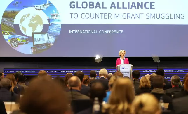 European Commission President Ursula von der Leyen addresses a Conference of the Global Alliance to Counter Migrant Smuggling at the EU Charlemagne building in Brussels, Wednesday, Dec 10, 2025. (AP Photo/Virginia Mayo)