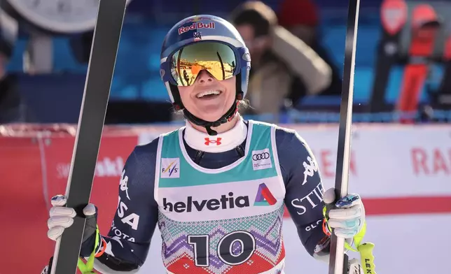 United States' Lindsey Vonn reacts after completing an alpine ski, women's World Cup super-G event, in St. Moritz, Switzerland, Sunday Dec. 14, 2025. (AP Photo/Luciano Bisi)