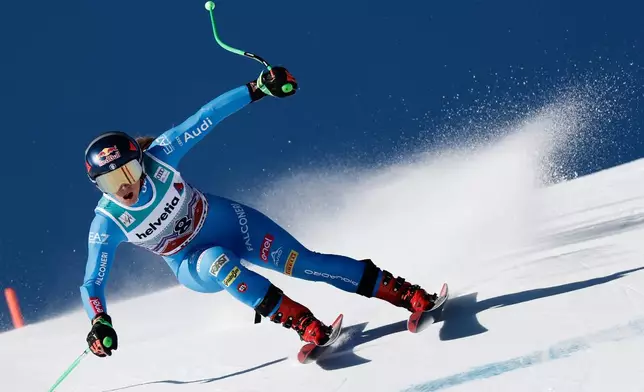 Italy's Sofia Goggia speeds down the course during an alpine ski, women's World Cup super-G event, in St. Moritz, Switzerland, Sunday Dec. 14, 2025. (AP Photo/Gabriele Facciotti)