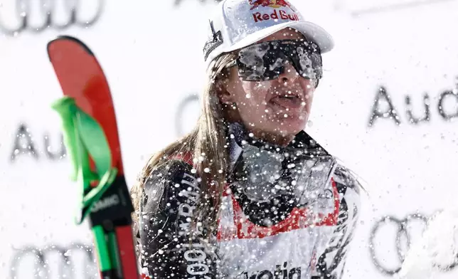 New Zealand's Alice Robinson celebrates winning an alpine ski, women's World Cup super-G event, in St. Moritz, Switzerland, Sunday Dec. 14, 2025. (AP Photo/Gabriele Facciotti)