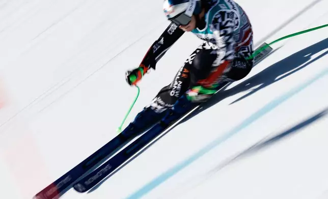 New Zealand's Alice Robinson speeds down the course during an alpine ski, women's World Cup super-G event, in St. Moritz, Switzerland, Sunday Dec. 14, 2025. (AP Photo/Gabriele Facciotti)