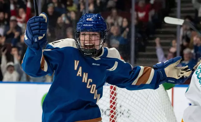 Vancouver Goldeneyes' Claire Thompson celebrates after a goal against the New York Sirens during the first period of a PWHL hockey game in Vancouver, British Columbia, Saturday, Dec. 6, 2025. (Ethan Cairns/The Canadian Press via AP)