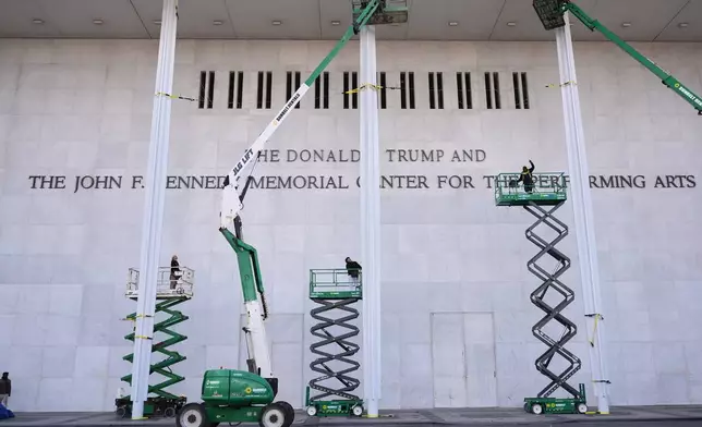 New signage, The Donald J. Trump and The John F. Kennedy Memorial Center For The Performing Arts, is unveiled on the Kennedy Center, Friday, Dec. 19, 2025, in Washington. (AP Photo/Jacquelyn Martin)