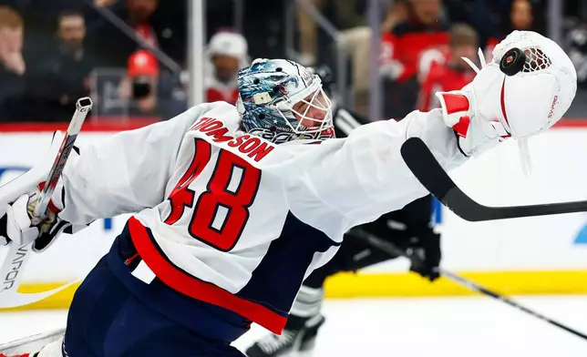 Washington Capitals goaltender Logan Thompson (48) defends against the New Jersey Devils during the second period of an NHL hockey game Saturday, Dec. 27, 2025, in Newark, N.J. (AP Photo/Noah K. Murray)
