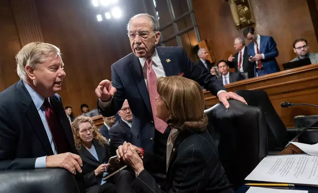 FILE - From left, Sen. Lindsey Graham, R-S.C., Senate Judiciary Committee Chairman Chuck Grassley, R-Iowa, and Sen. Dianne Feinstein, D-Calif., the ranking member, confer before considering a bipartisan bill to protect the special counsel from being fired, on Capitol Hill in Washington, Thursday, April 26, 2018. (AP Photo/J. Scott Applewhite, File)